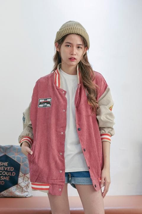 Foto model menggunakan produk Jade Suede Varsity Jacket