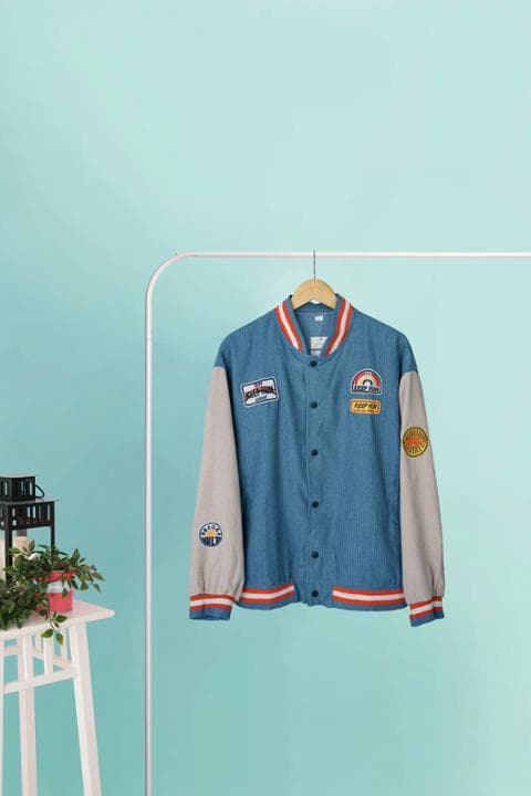 Foto model menggunakan produk Jade Suede Varsity Jacket