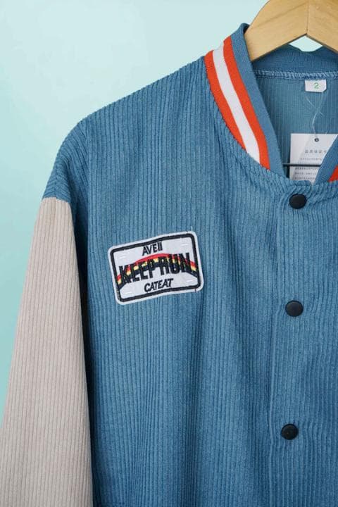 Foto model menggunakan produk Jade Suede Varsity Jacket
