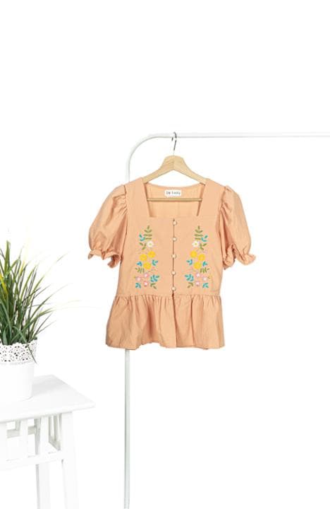 Foto model menggunakan produk Camila Flower Peplum Blouse
