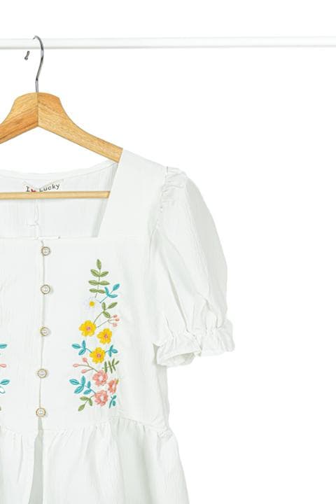 Foto model menggunakan produk Camila Flower Peplum Blouse