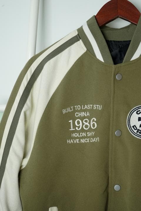 Foto model menggunakan produk Erza Vintage Varsity Jacket